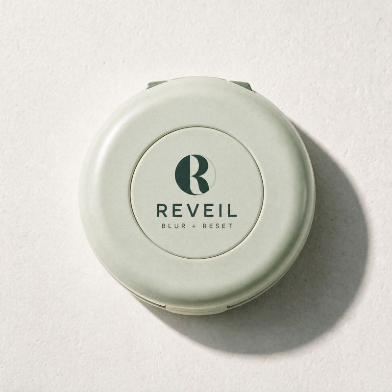 The closed Reveil compact, sage green with the R logo