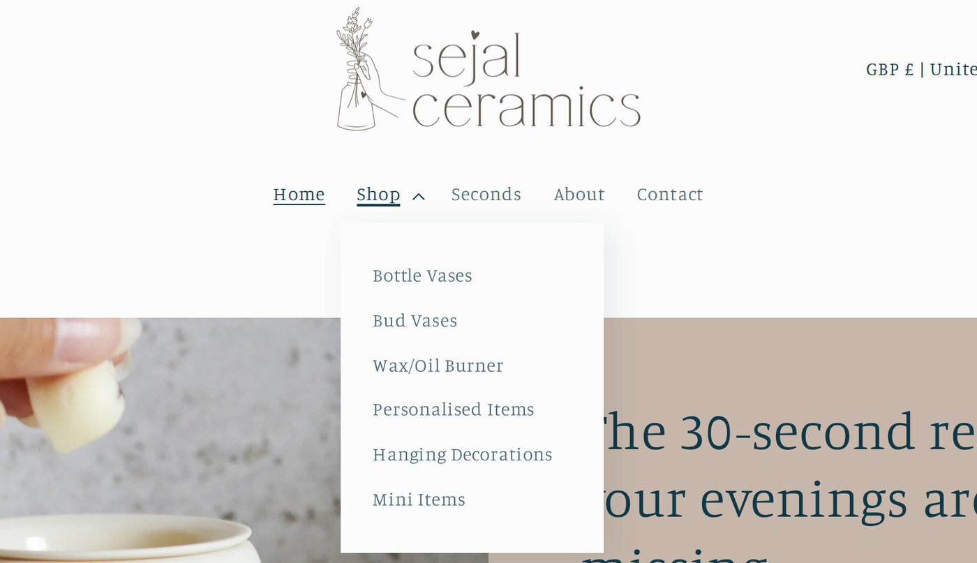 The Shop menu open, listing six product collections