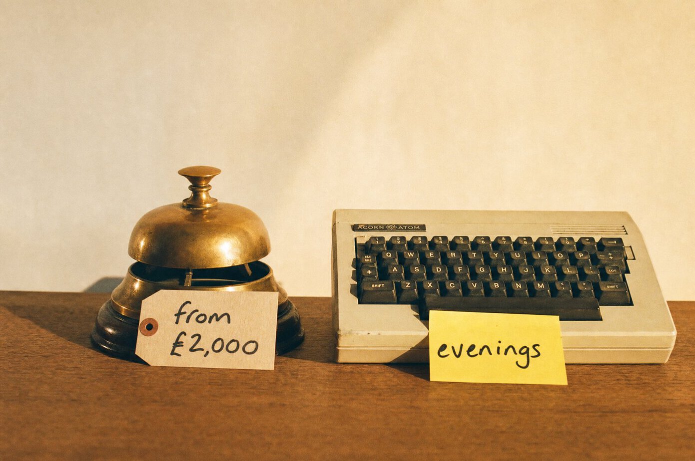 A shop bell priced from £2,000 next to a retro keyboard labelled evenings: the real cost of a Shopify designer versus Claude